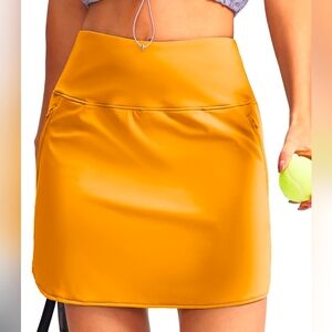 G Gradual athletic skirt / skort size L in an orange/yellow color.